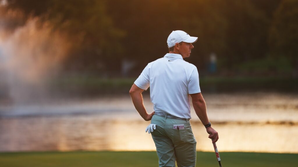 Golfer beside the water at The K Club, Straffan